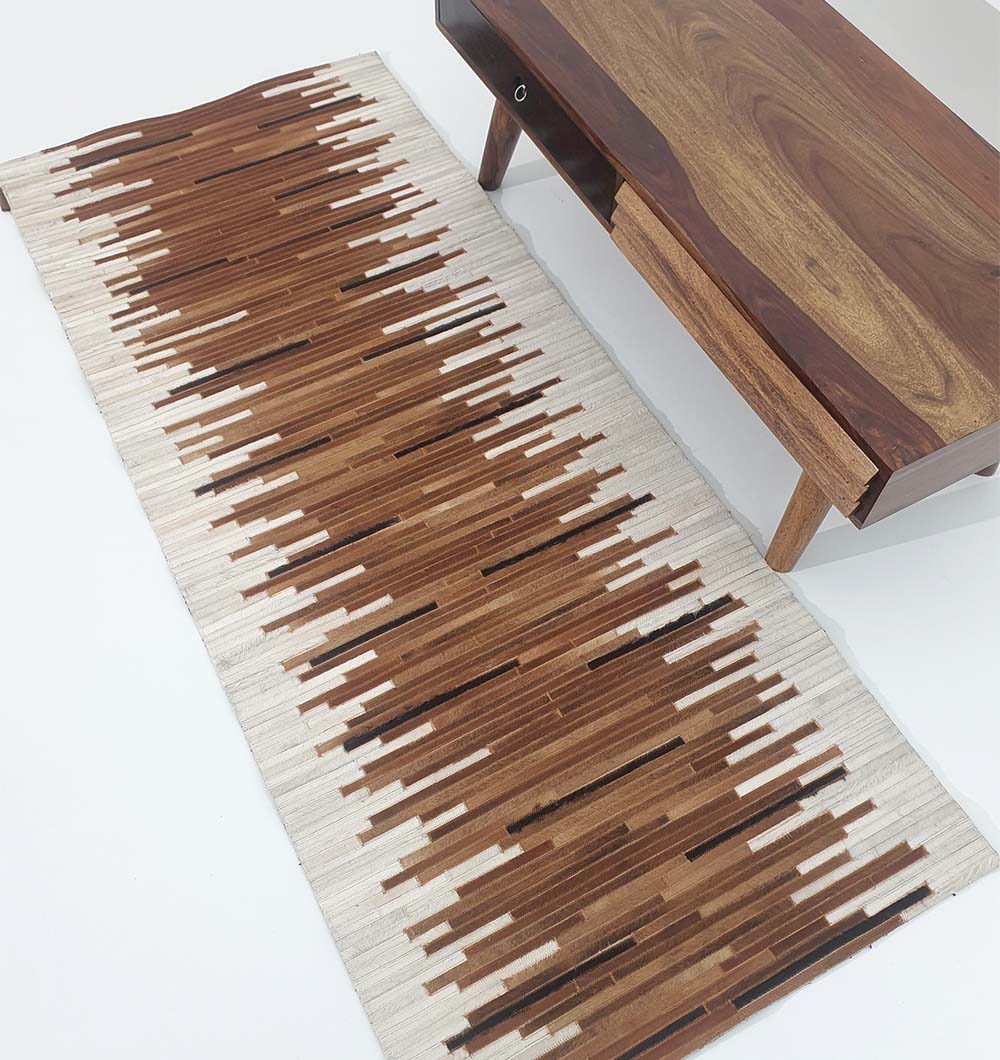 Vibrant handmade multicolor leather rug used in a bohemian-inspired interior with natural accents and creative decor elements