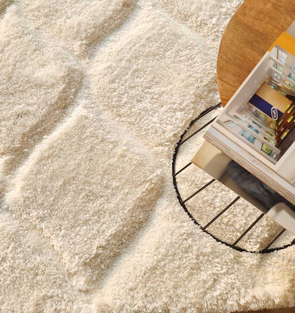 Close-up view emphasizing the warmth and inviting feel of the handmade rectangular carpet's texture.