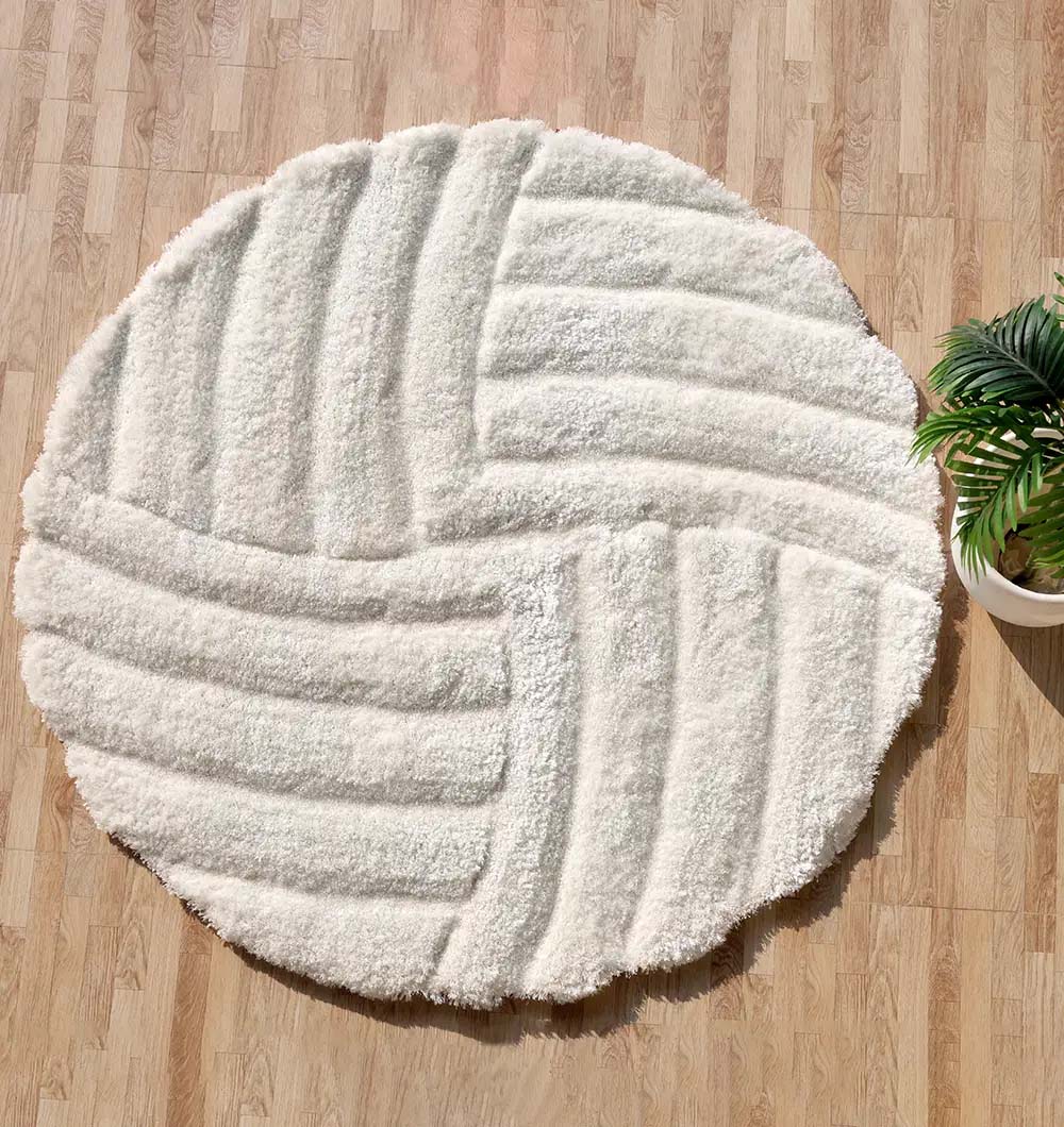 Luxury shaggy rug, a modern soft carpet in white/cream color, offering plush texture for elevated home decor.