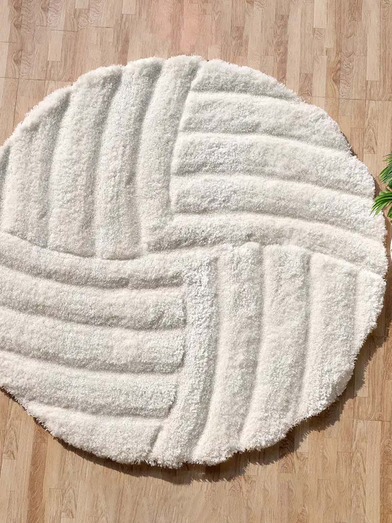 Luxury shaggy rug, a modern soft carpet in white/cream color, offering plush texture for elevated home decor.