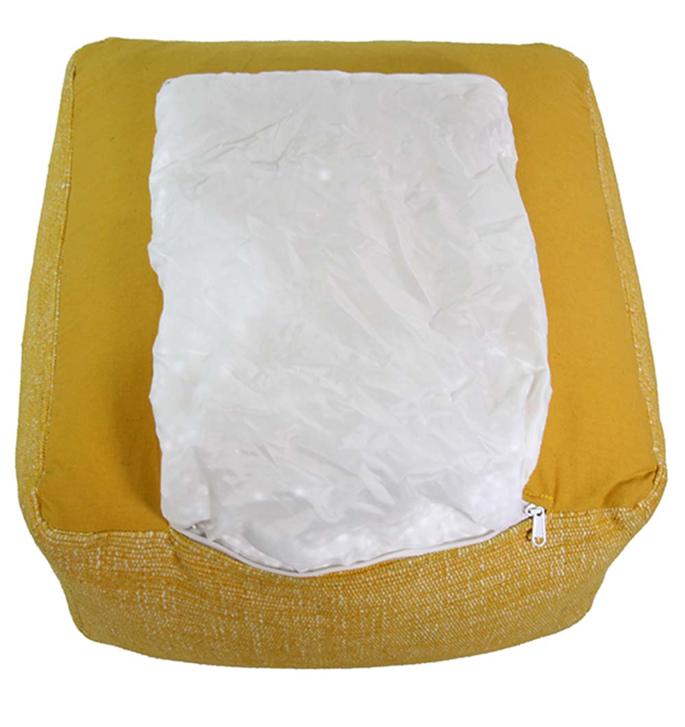 Close-up of handmade yellow cotton pouf showing fine woven texture and soft, durable cotton fabric.