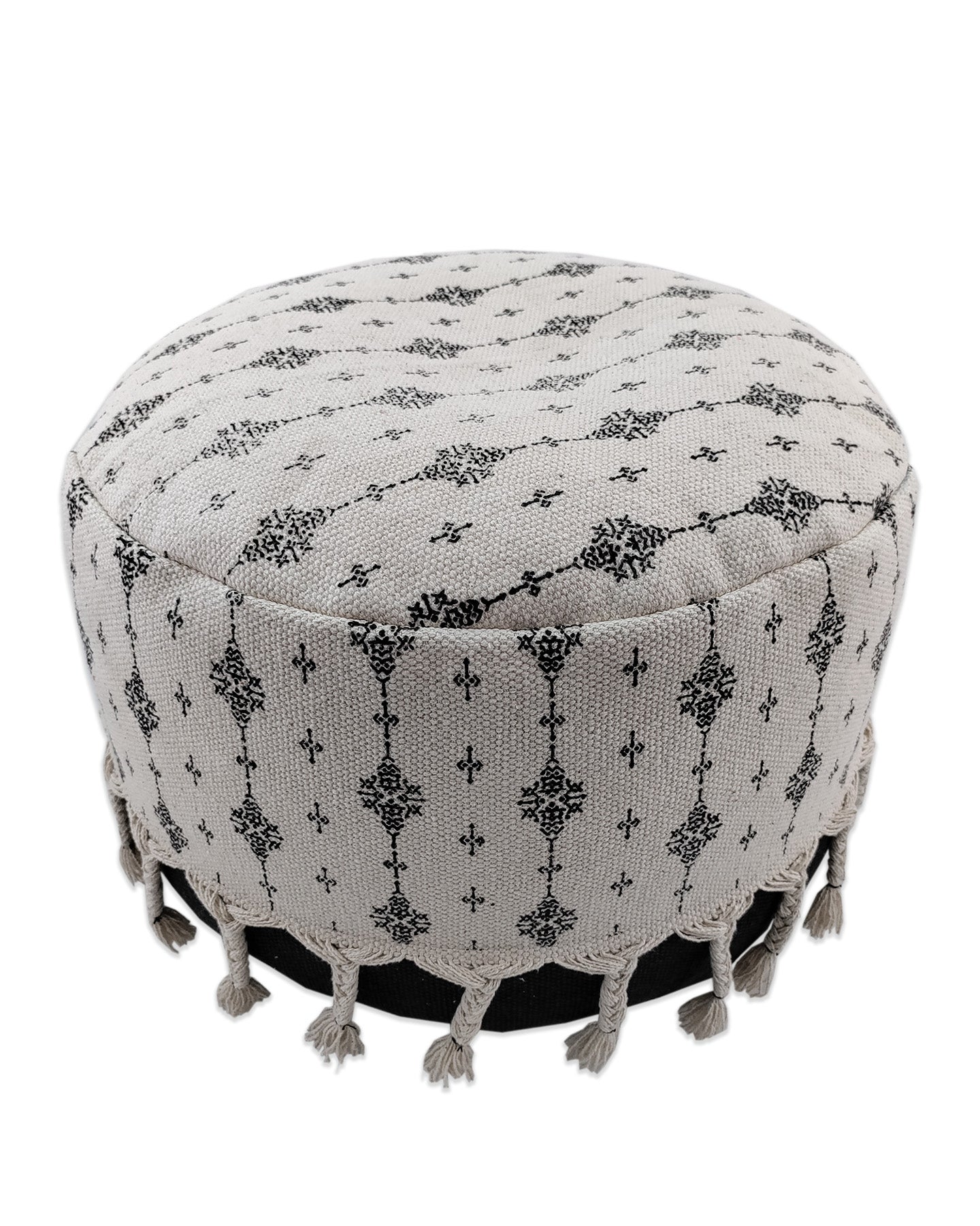 Stylish black and white patterned cotton pouf with textured fringes, perfect as a modern accent for living rooms or bedrooms.