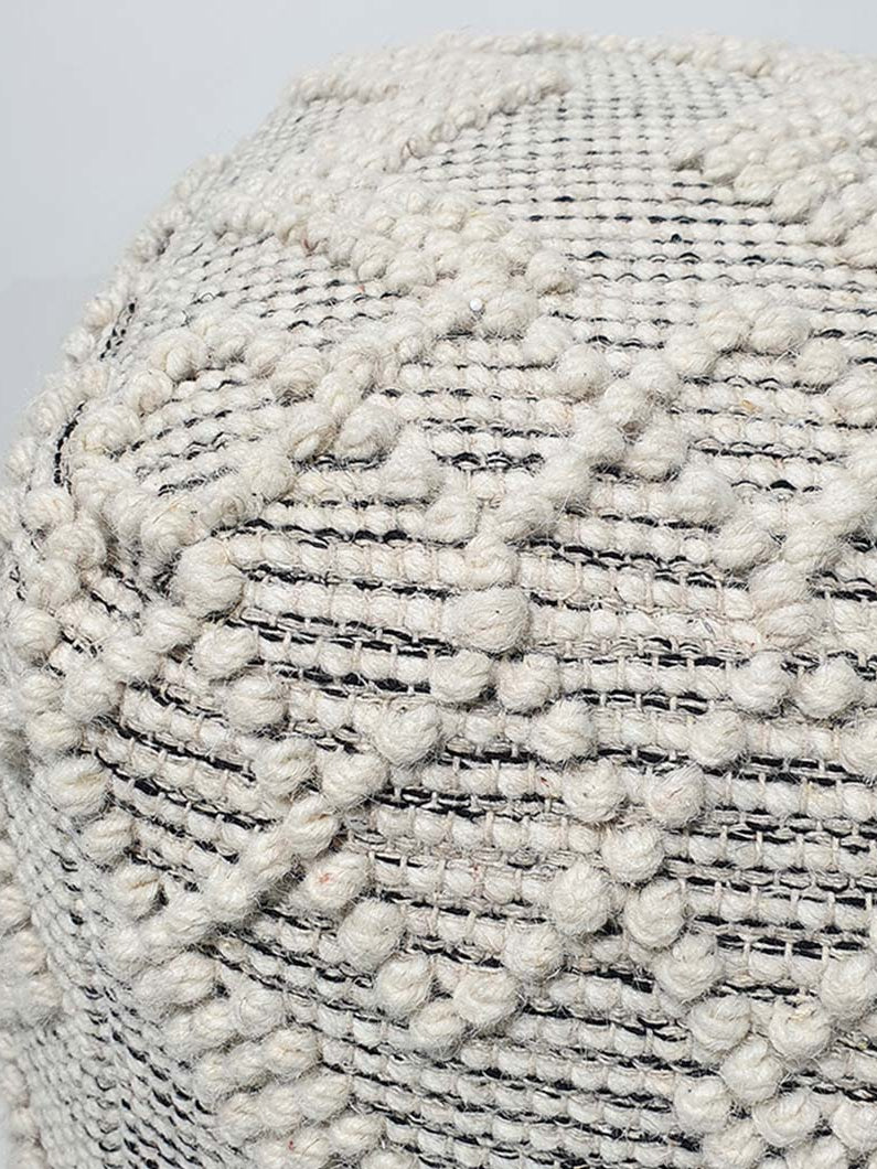 Close-up view of handmade wool and cotton pouf PF-137 showing detailed woven texture and natural fabric finish