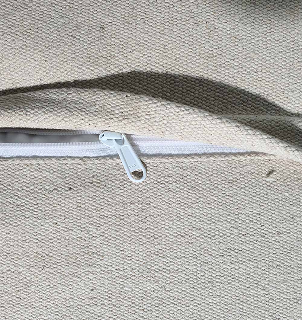 Handmade natural pouf PF-137 close-up showing soft wool fibers and artisanal craftsmanship