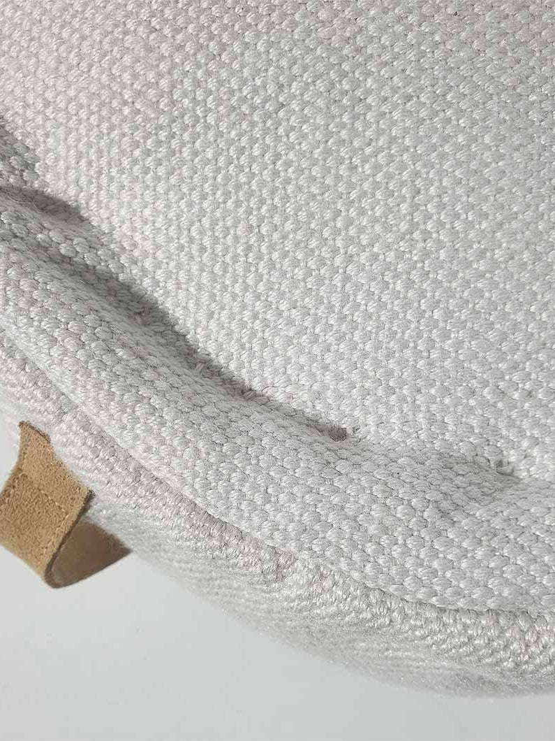 Detailed close-up of 100% polyester pouf PF-142 showing textured woven pattern and fine craftsmanship