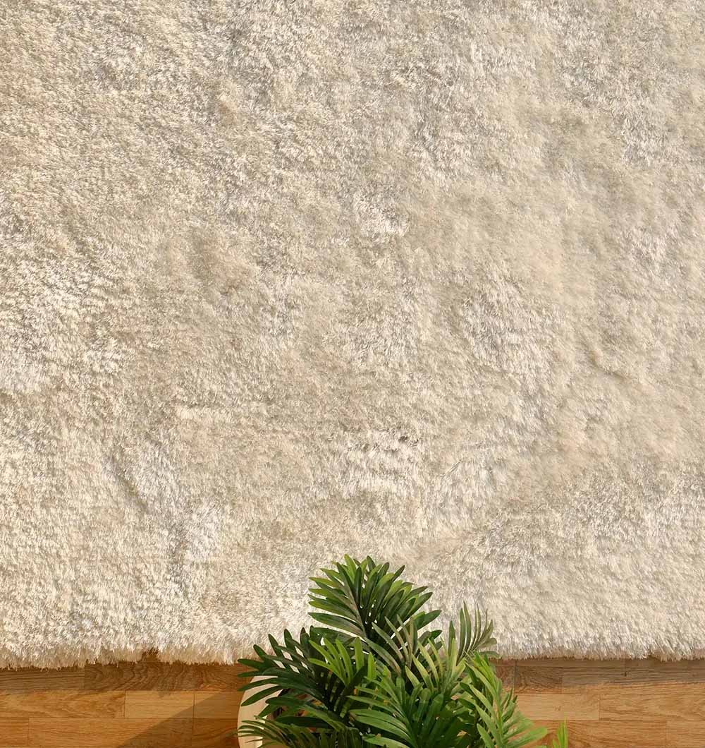 Close-up detailing the plush texture and bright white color of the soft and comfort shaggy handmade rug.