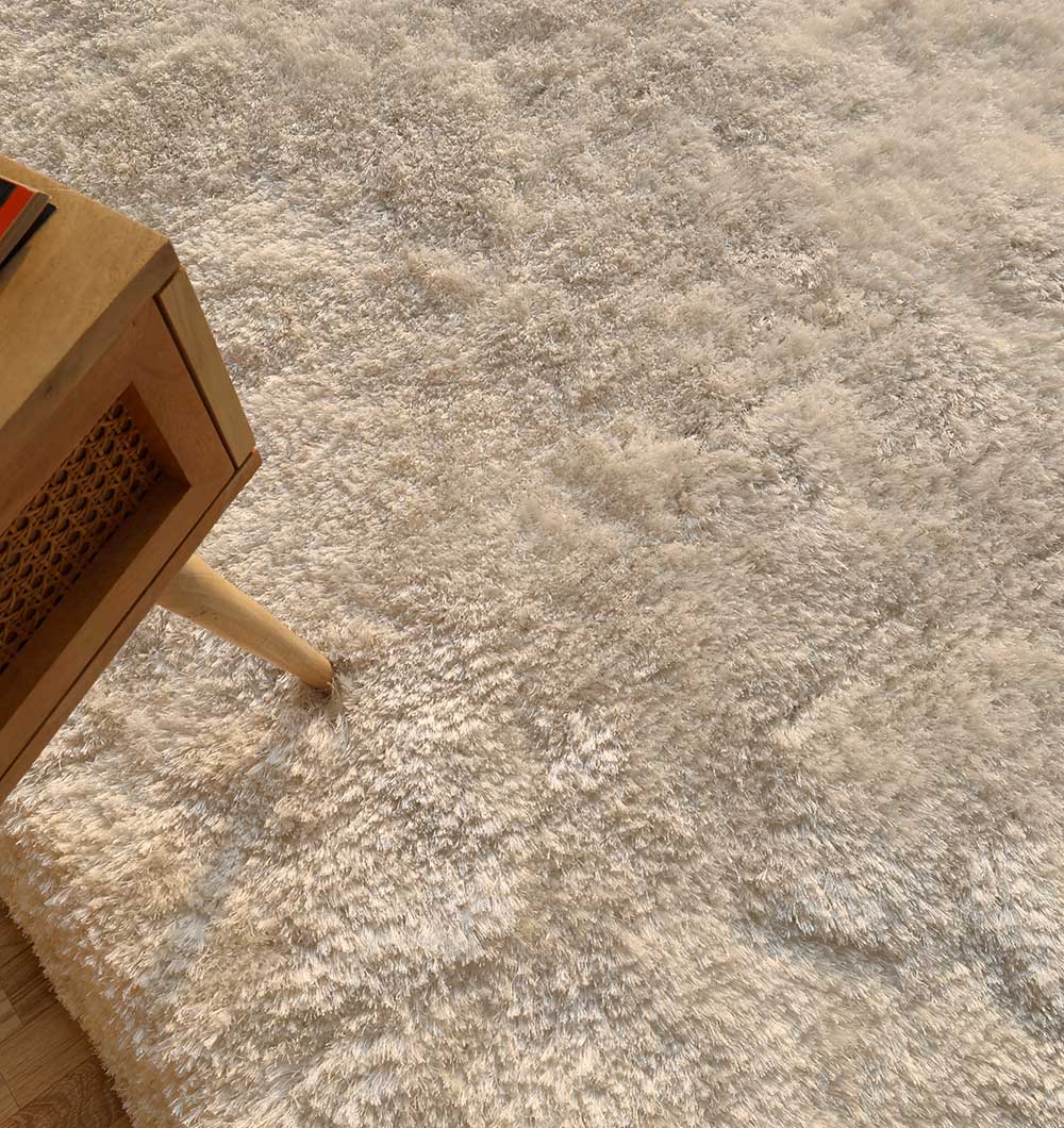 Close-up of the shaggy rug next to home decor, showing how the unique design adds a touch of sophistication to the space.