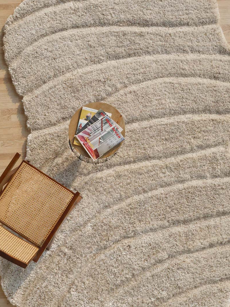 Overhead view of the irregular shaggy rug in a styled room, emphasizing its unique character and the warmth it brings to the space.