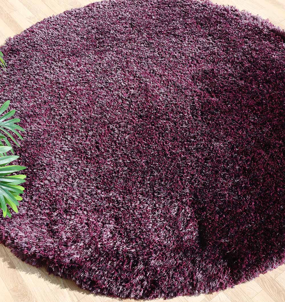 Side view of the irregular plush rug, showcasing the depth and thickness of the white modern shaggy pile.