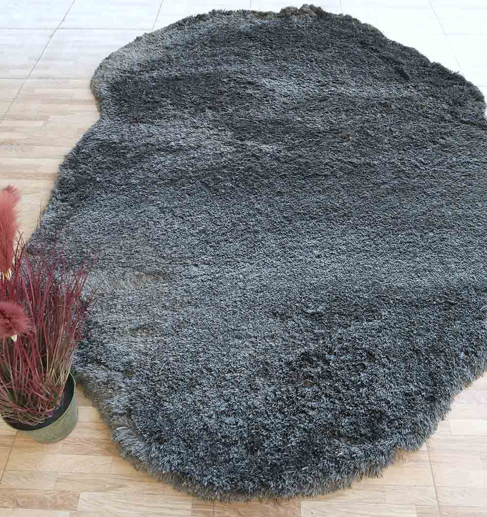 Dark grey irregular shaggy rug, a versatile floor accent designed for durability in high-traffic modern spaces.