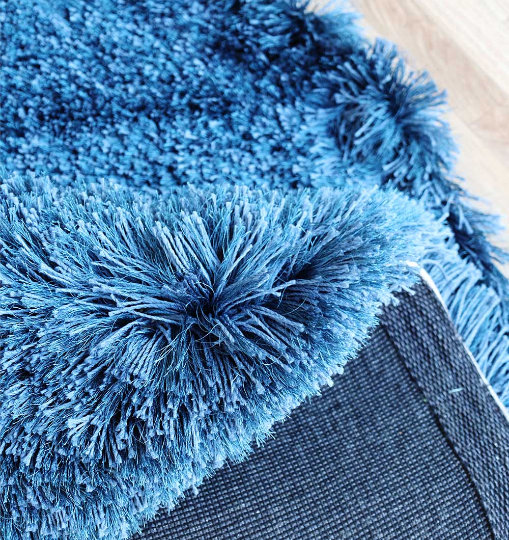 Close-up detailing the plush surface and superior softness provided by the $80% polyester, $20% cotton material composition.