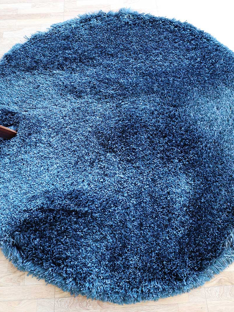 Irregular blue color plush rug, featuring a modern shaggy design for superior softness and durability.