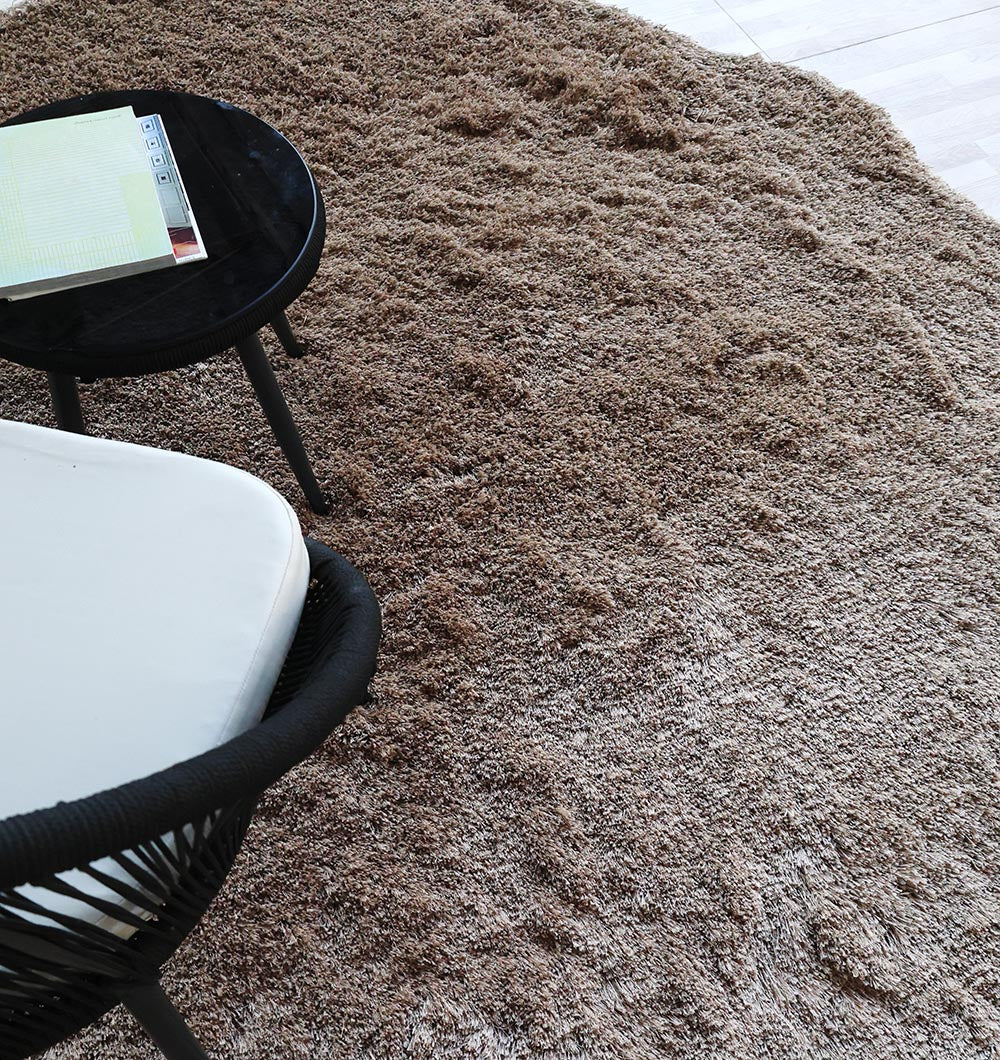 Angled top close-up showcasing the unique character and sophisticated aesthetic of the irregular brown plush surface.