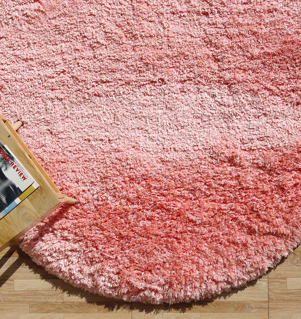 Side close-up highlighting the plush texture and the thick, comforting pile of the pink irregular rug.