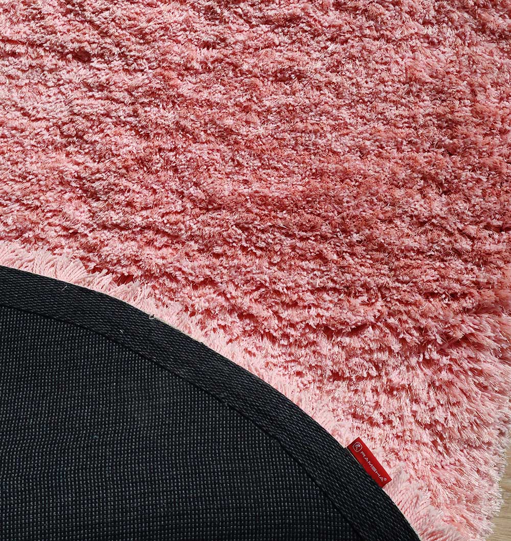 Backside of the pink irregular plush rug, confirming the durable backing and high-quality weave.