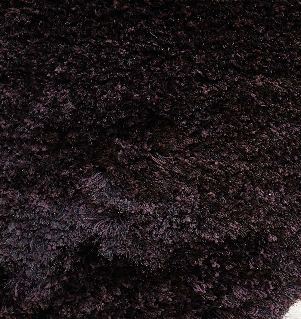 Detailed shot focusing on the lasting durability and thickness of the soft plush irregular carpet.