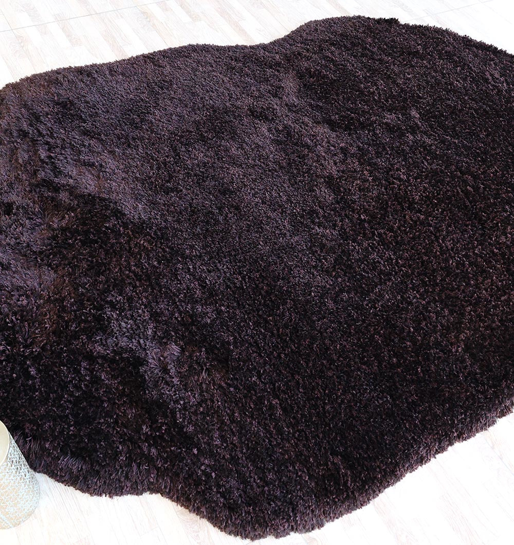 Extreme close-up of the fibers, highlighting the warmth and inviting texture of the dark brown material.