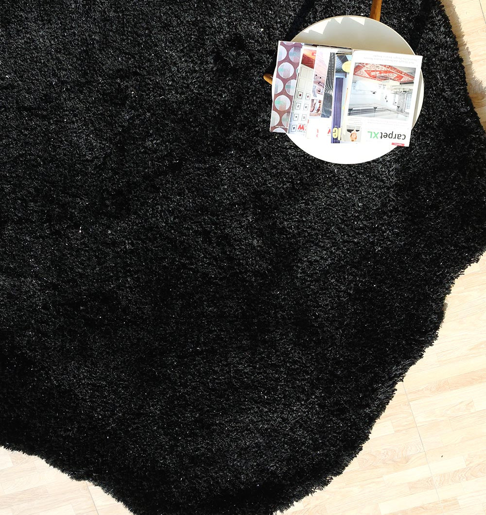 Overhead shot showing the unique irregular shape and thick shaggy pile, seamlessly blending into the contemporary space.