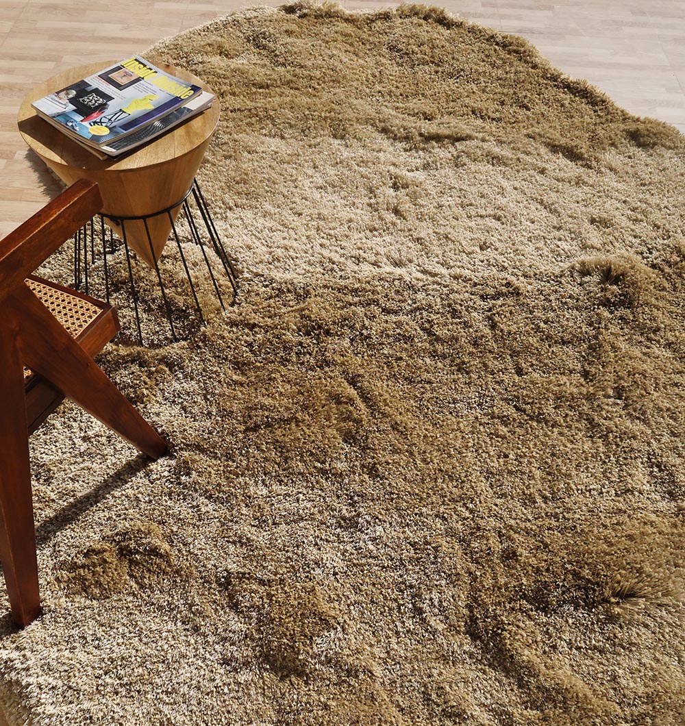 Side angle of the irregular rug, clearly showing the thick pile height and unique profile of the plush shaggy fibers.