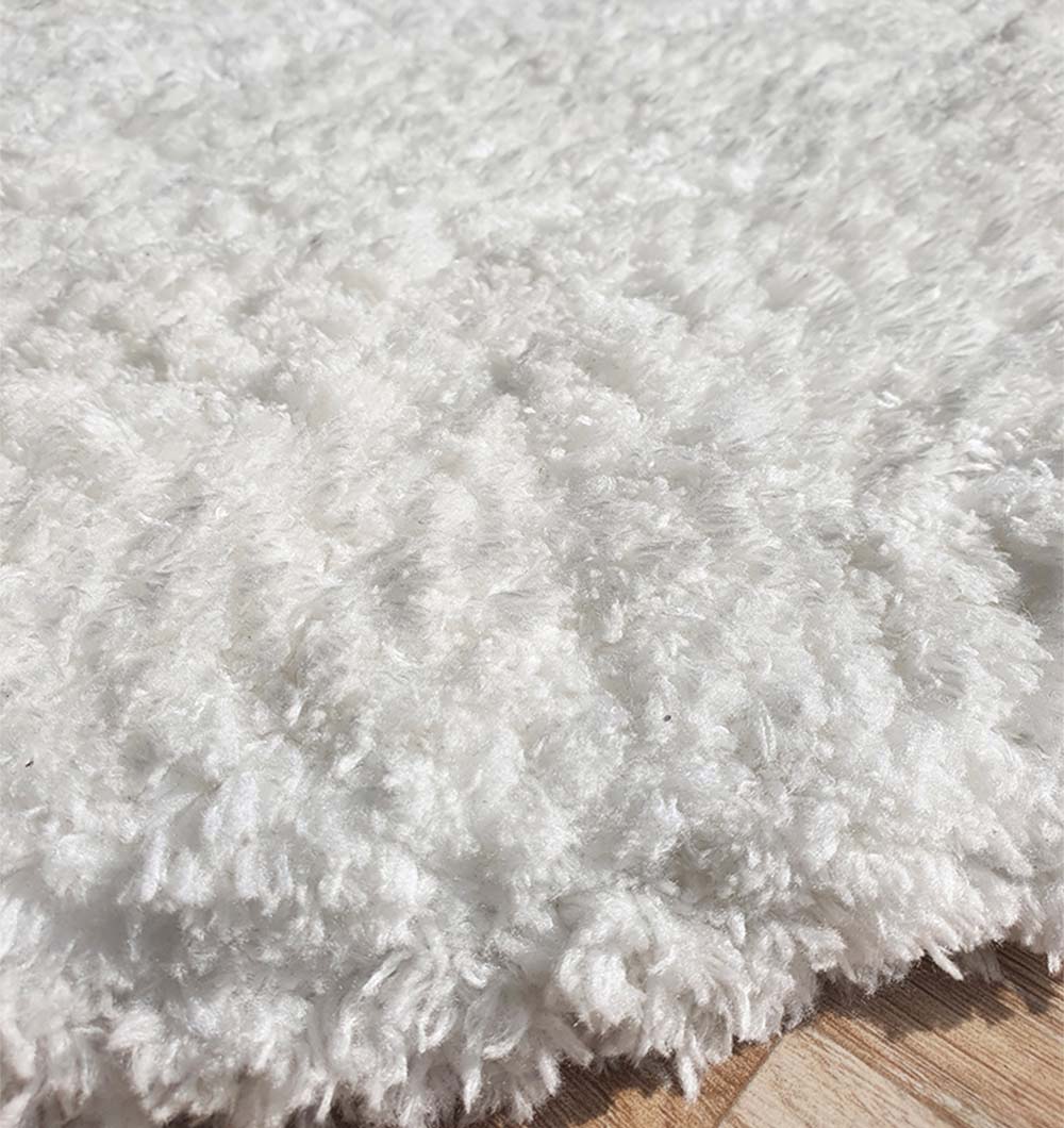 Plush white rectangular carpet, emphasizing its ultra-soft texture and inviting fluffiness.
