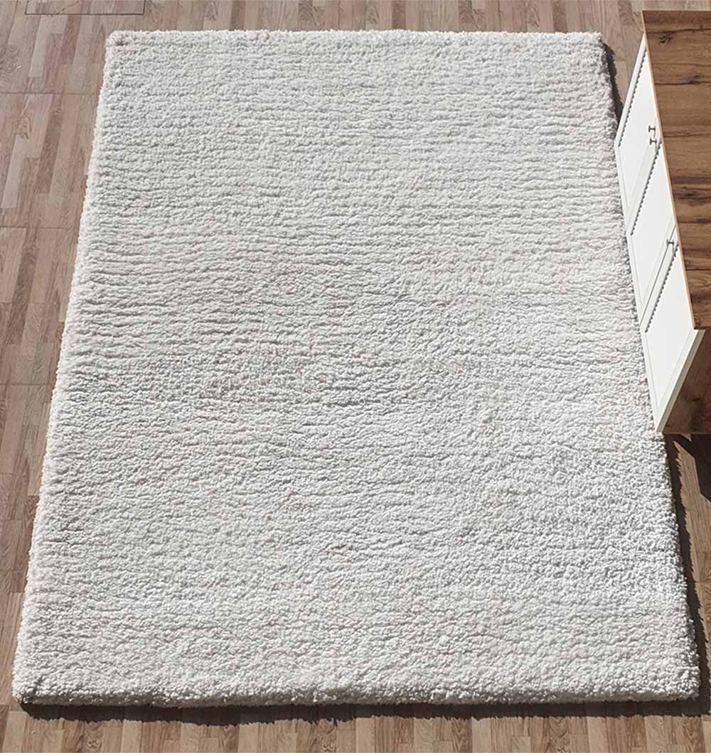 Top-down view of the plush white rectangular carpet, emphasizing its ultra-soft texture and inviting fluffiness.