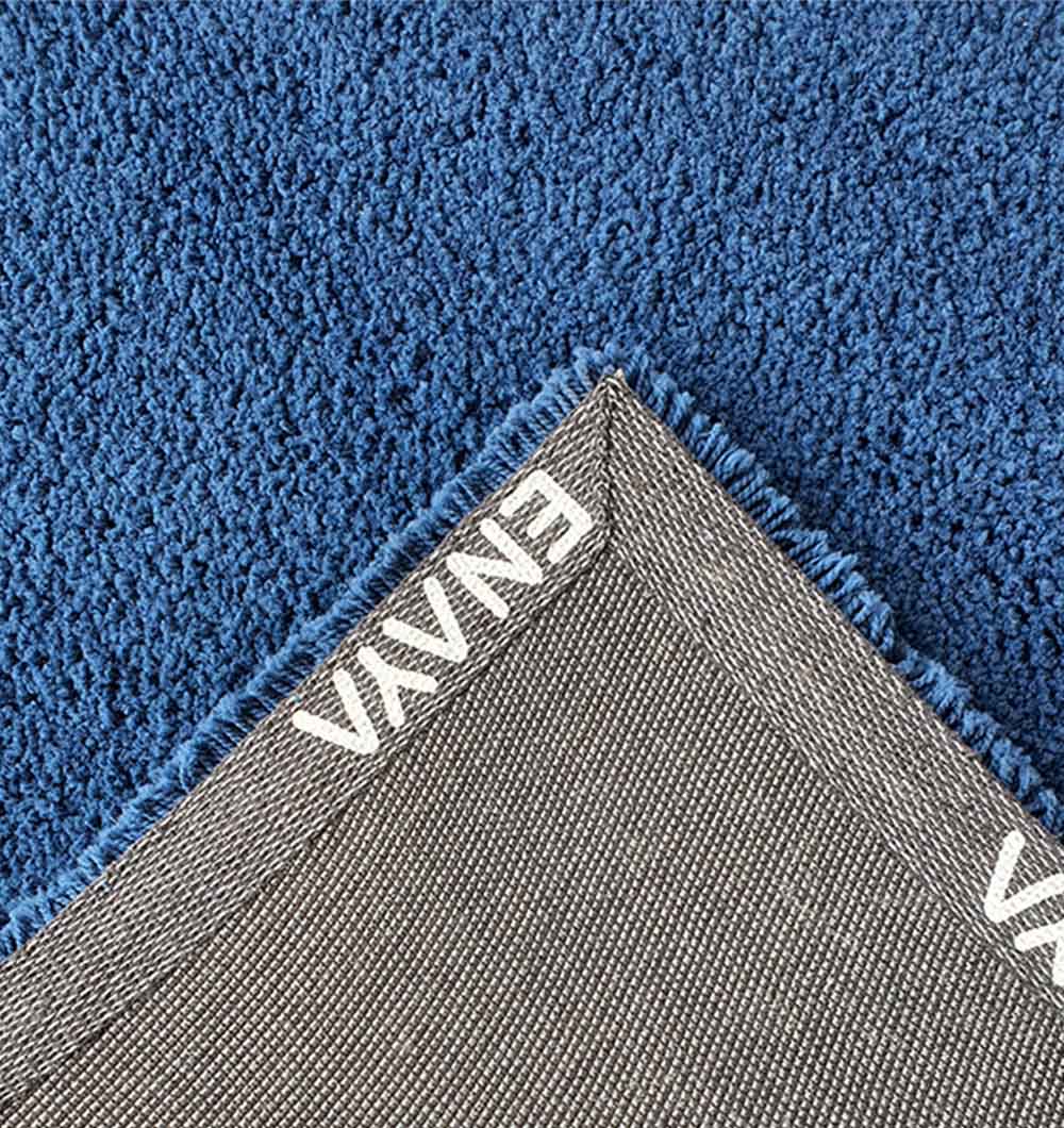 Backside of the rectangular shaggy rug, confirming the durable backing and meticulous handmade construction.