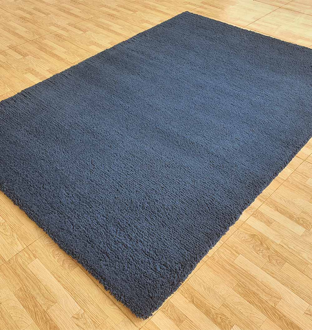 Side angle of the rectangular rug, clearly displaying the thick pile height and soft texture for ultimate comfort.