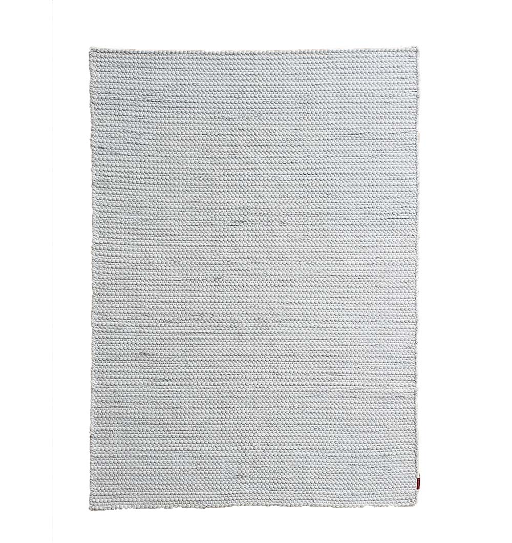 Main image of the natural white woven rug, handmade from 100% recycled PET yarn for a durable and eco-friendly floor covering.