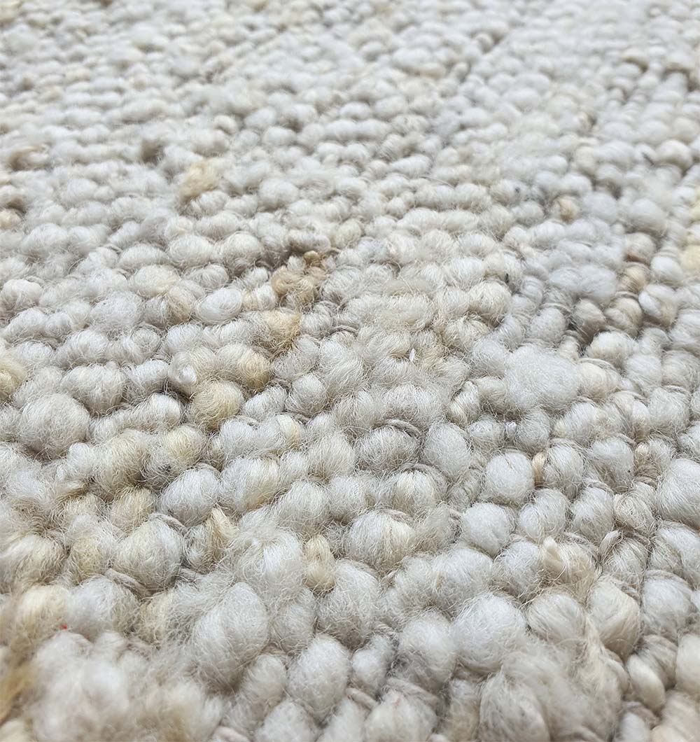 Close-up detailing the distinct woven texture and natural fibers of the 90% wool and 10% cotton blend.