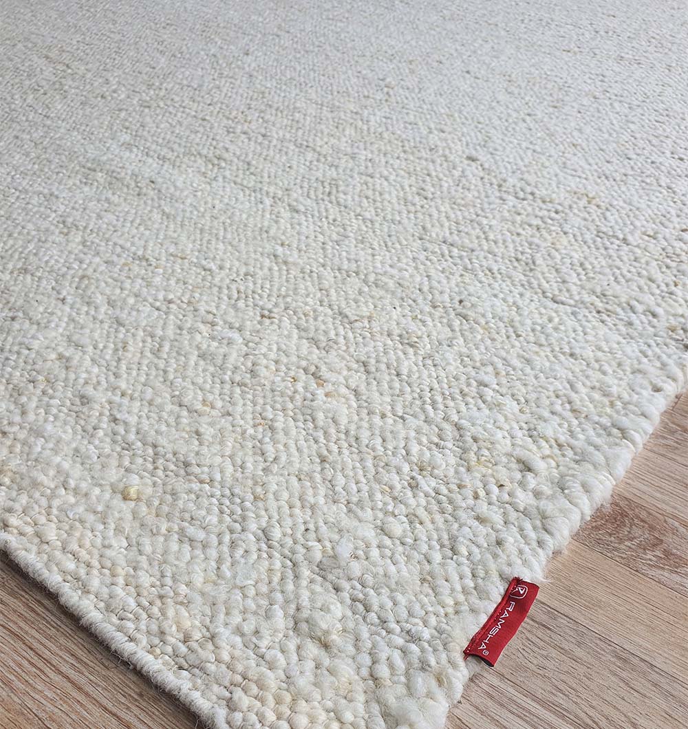 Side close-up showcasing the quality of the handmade construction and the robust edge weave of the natural area rug.