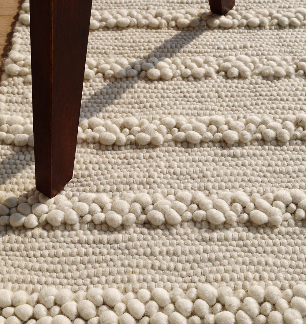 Ultra-detailed shot showing the refined individual threads and variations resulting from traditional weaving techniques.