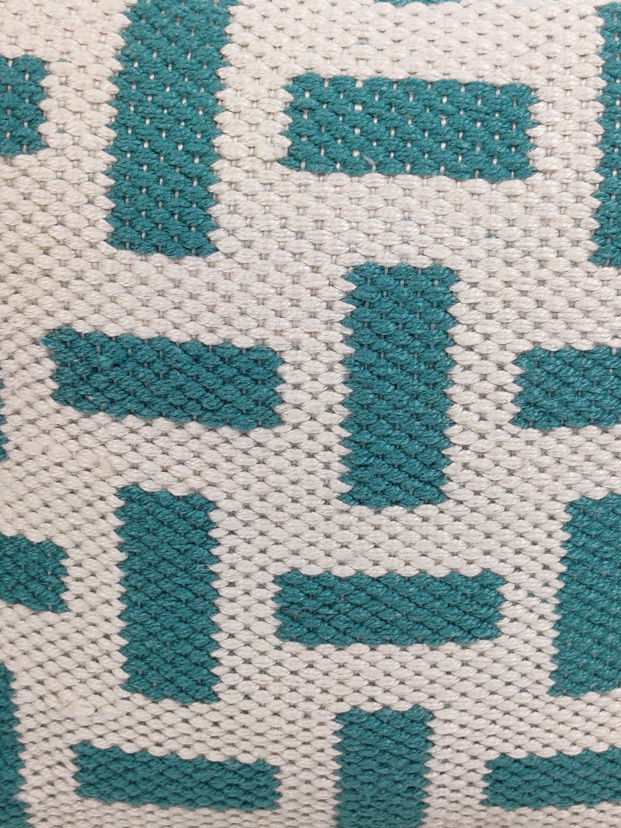 Close-up of light blue and cream pouf PF-112 showing woven polyester fabric and texture