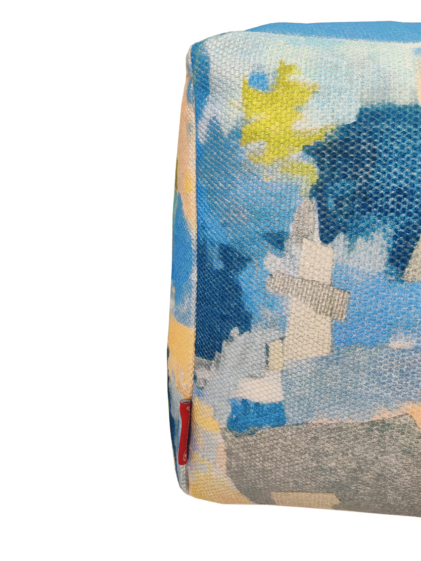 Close-up of PF-114 pouf showing vibrant printed polyester fabric and woven texture